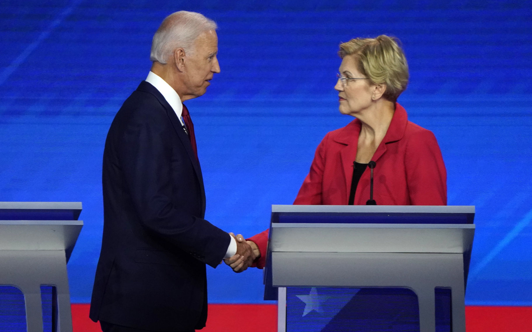 Former Vice President Biden shake hands with Senator Warren at the conclusion of the 2020 Democratic U.S. presidential debate in Houston, Texas, U.S.
